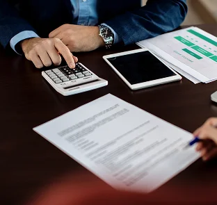 Person doing bookkeeping on laptop for BAS lodgement services at Kennedy Tax Melbourne
