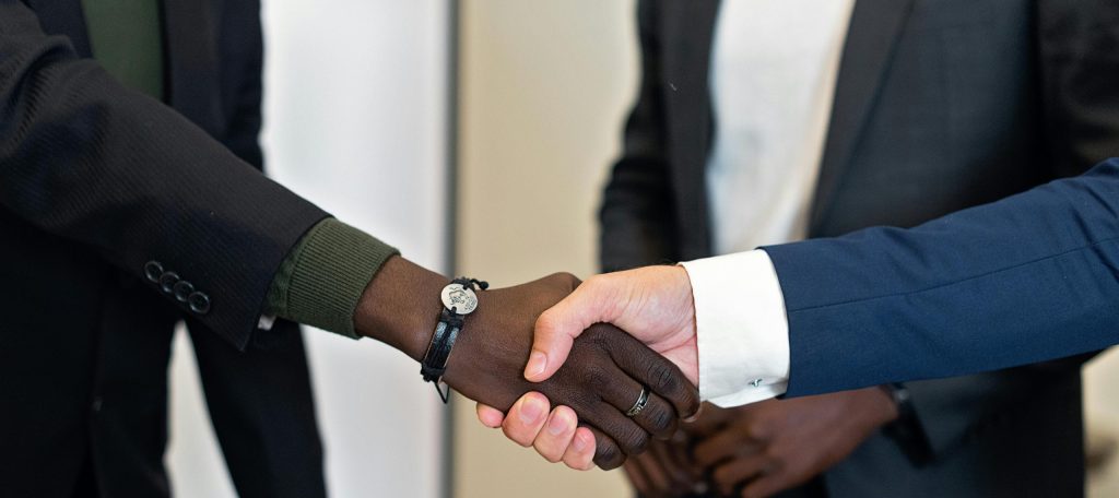Kennedy Tax accountant and client shaking hands after trust account audit consultation in Melbourne